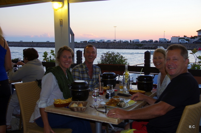 Sampling moules marinieres et loup de mer on a restaurant along the Herault River, in Grau d