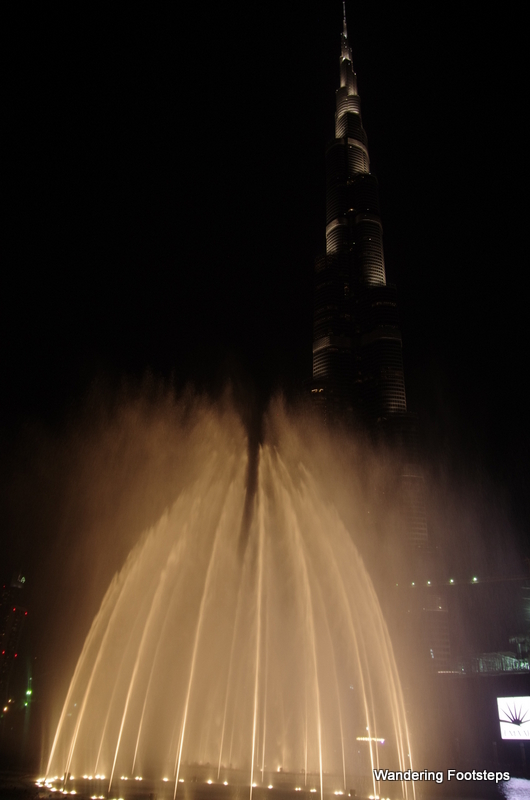 The water and lights show at the Dubai Fountain, with Burj Khalifa (the tallest tower in the world) behind.