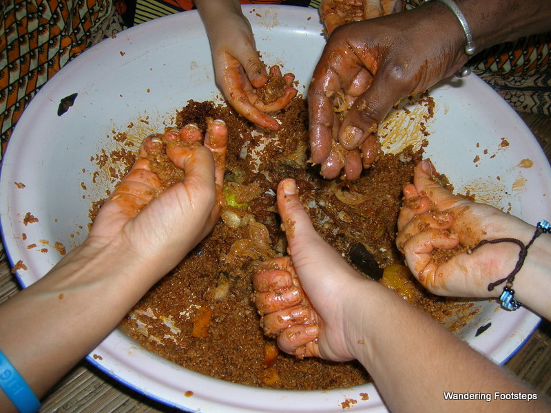 Tasting ceebu-jen, a Senegalese dish, for the first time.  I've since fallen in love with eating with my hands.