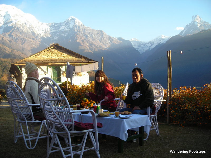 Taking breakfast with my friend Muna and her father before hiking the Annapurna range in Nepal's Himalayas.