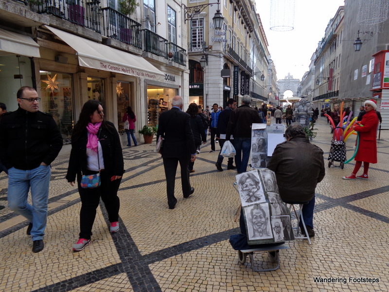 Lots of action in the main pedestrian street of Baixa.