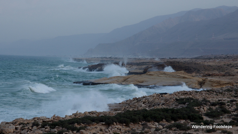 Waves crashing onto the rocky coast of windy Oman.