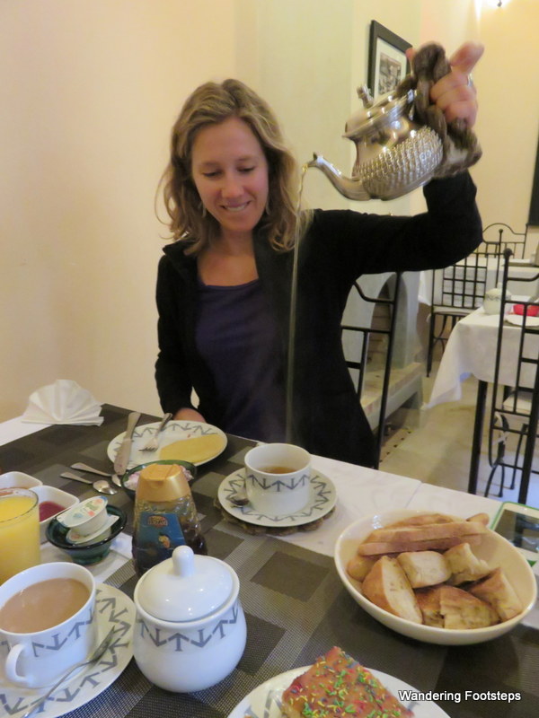 I'm demonstrating the pouring of Morccan mint tea at breakfast at the riad.