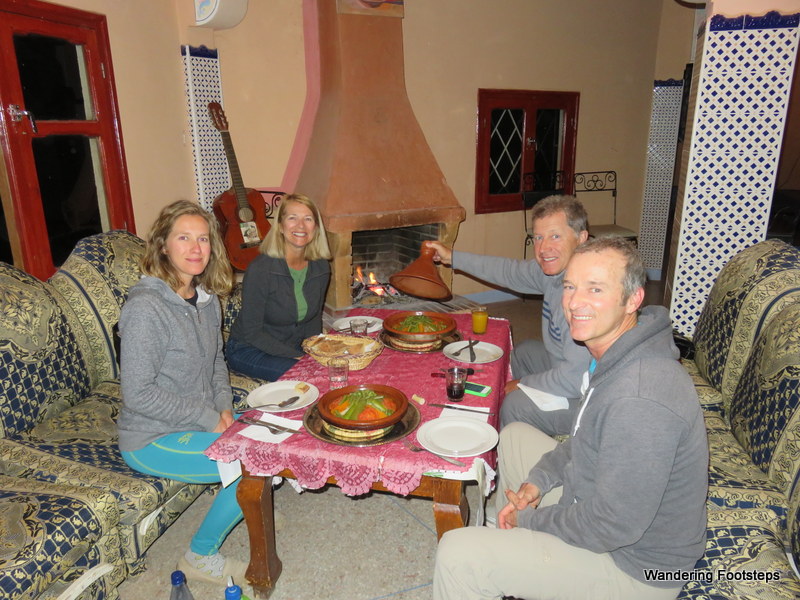 Sharing Moroccan tagines for dinner, with the fireplace behind fending off the cold.