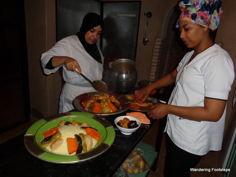 Hafida and Atika plating couscous for a special meal during our family reunion.