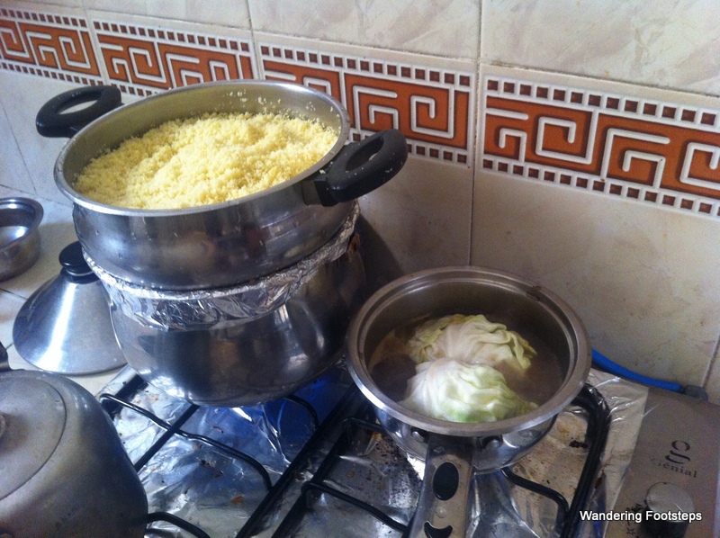 Couscous being steamed on a double-boiler.
