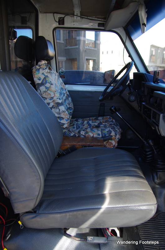 View of the cab from passenger seat.  In the middle is a lock-box.