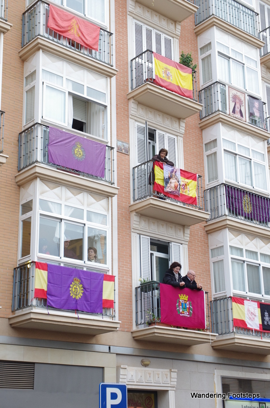 Flags with religious insignia hung from balconies, and residents loitering, clearly waiting for something big to happen.