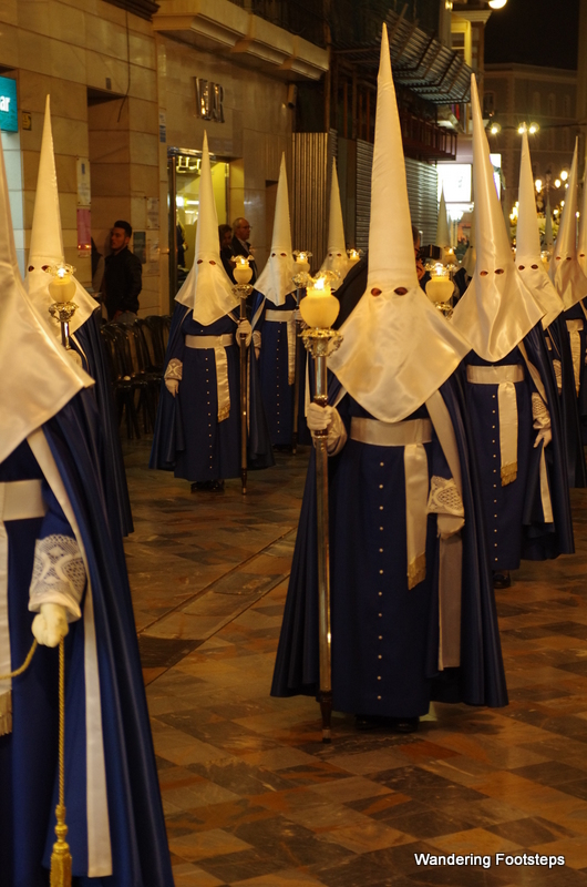 The evening's procession with KKK-like outfits.