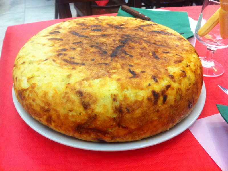 Spanish omelette, or tortilla.  I wish I had placed an object in this photo to show you exactly how large it is!