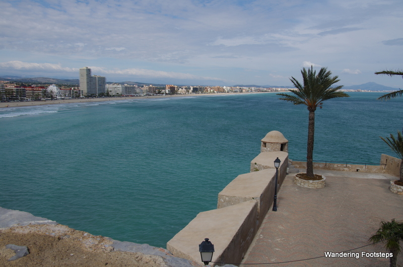 View of Peníscola's city beach and promenade from its castle-like old town.