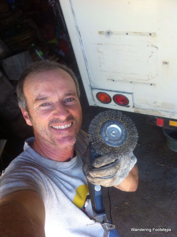Bruno's hard at work stripping paint, but not too busy to snap a selfie for me!
