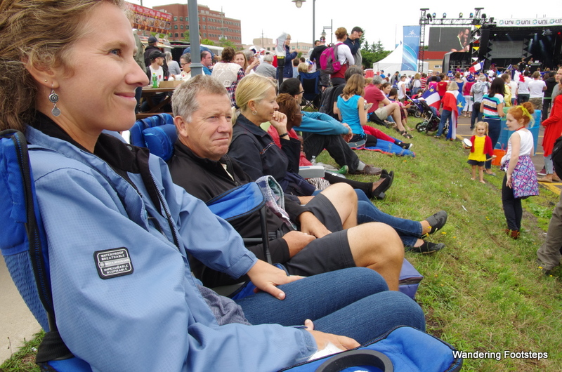 The family watching all the action for the Fete des Acadiens.