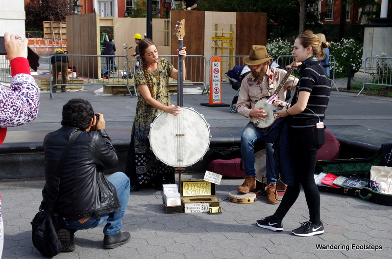Street musicians in Washington Square on a sunny fall day.