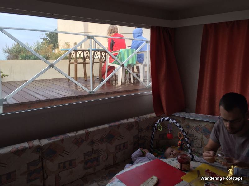 Bruno's niece and family stayed in the mobile home on our property.  Here, they're getting their big family organized for the day while Bruno and I take breakfast on the veranda.