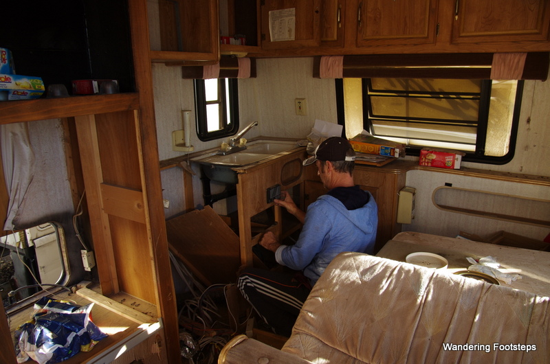 Disassembling hardware and cupboards inside a salvaged RV.  A very surreal experience to step inside these RVs becuase, in most instances, the owners' personal effects were still strewn about inside the vehicle.  We saw tons of food, clothing, and even children's homework!  Makes you wonder what the families were up to before their personal tragedy...