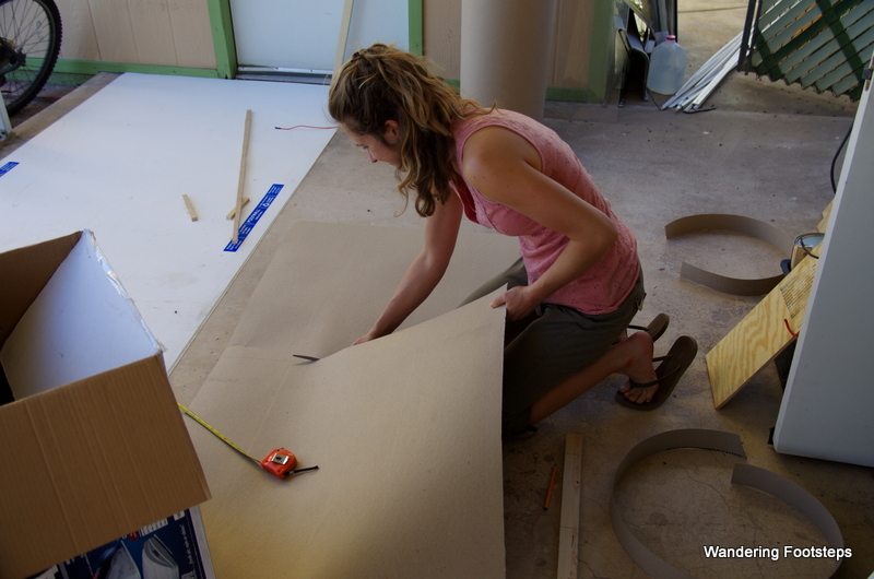Look at me go!  I'm cutting cardboard to get the shape of the shower walls which I will then trace onto the FRP board.