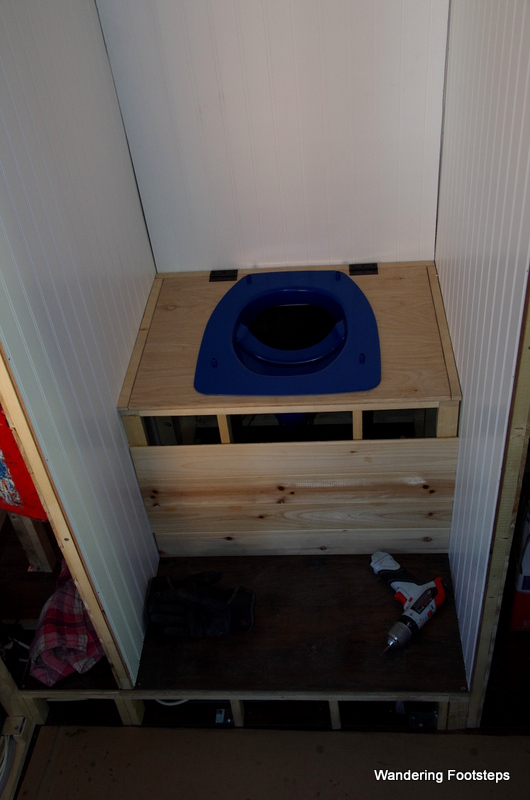 Toilet seat installed, box almost complete.