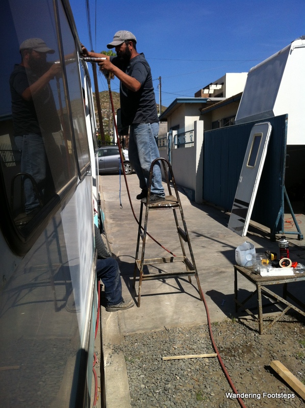 Adolpho installing our new RV door, woot woot!