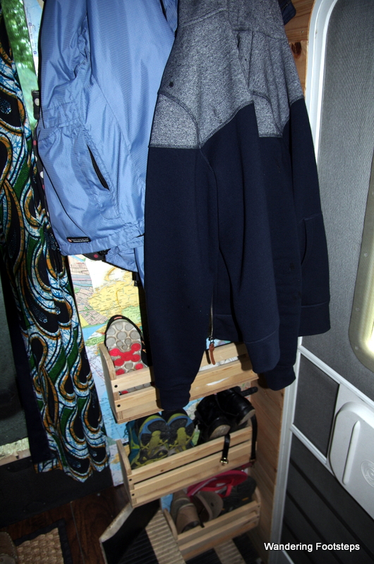 Another practical addition - our bookshelf and coat rack.  We have a mud room in our bus!!